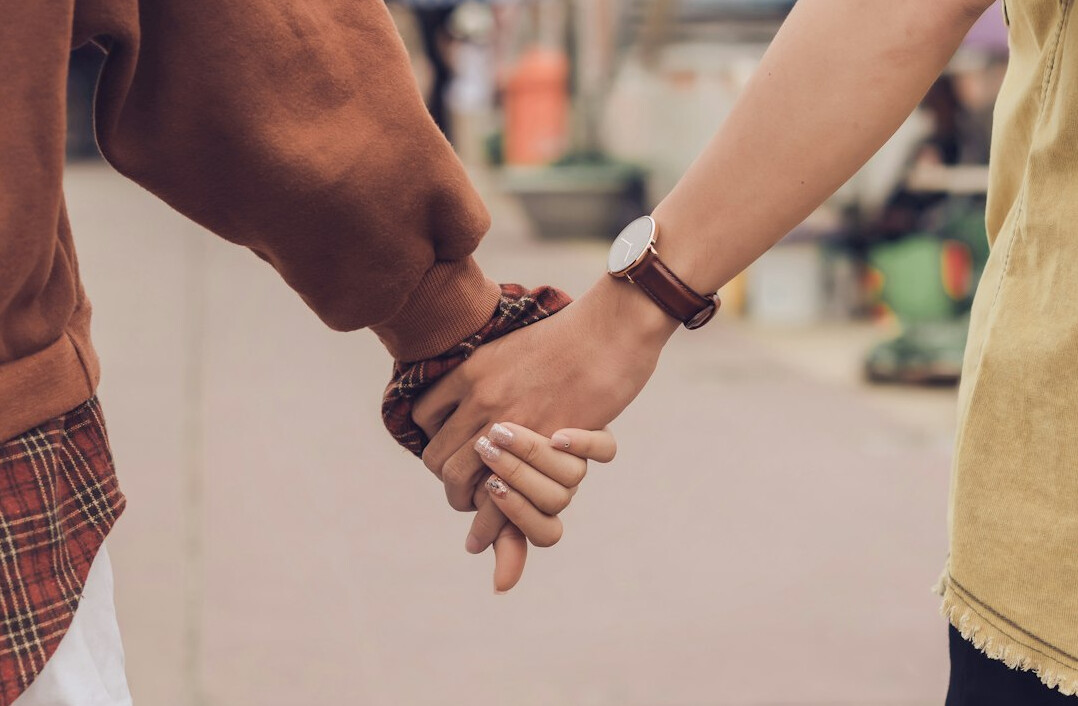 Two business partners shaking hands in an office