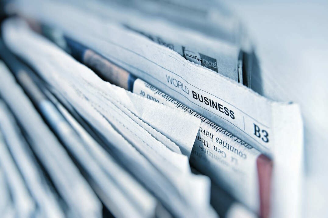 newspaper headline reading