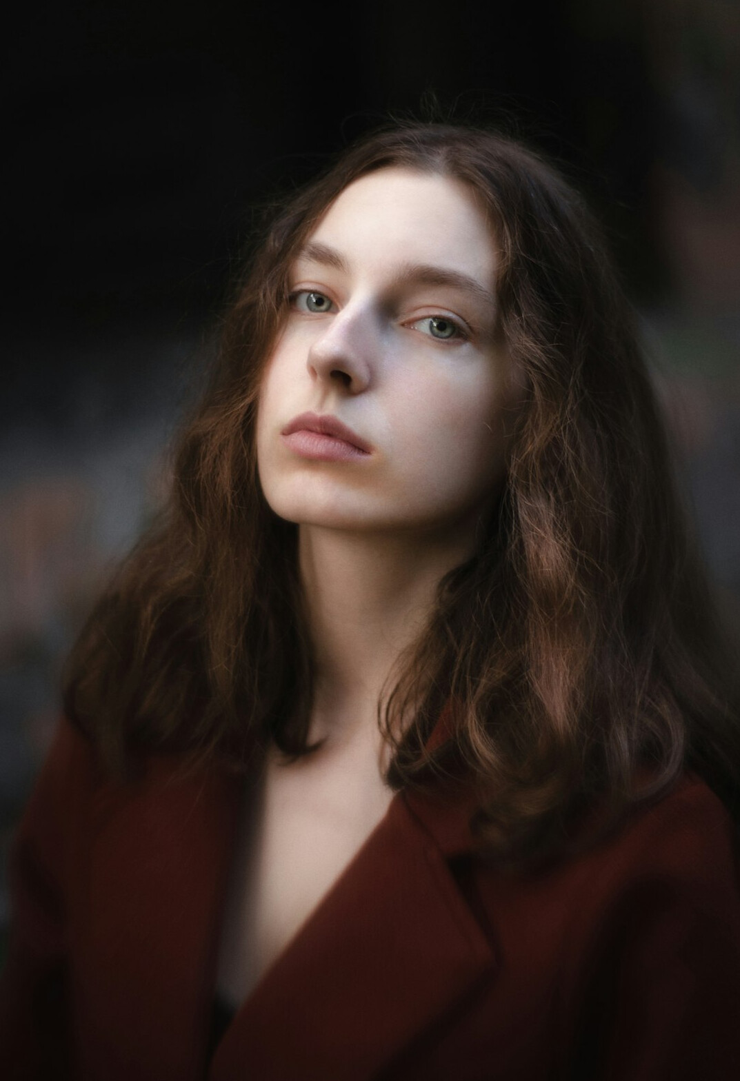 Studio portrait of a European woman with curly hair