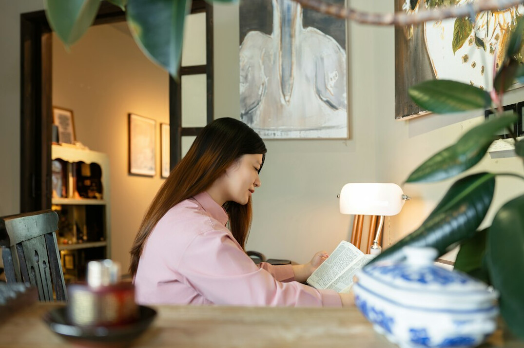 woman writing novel at desk