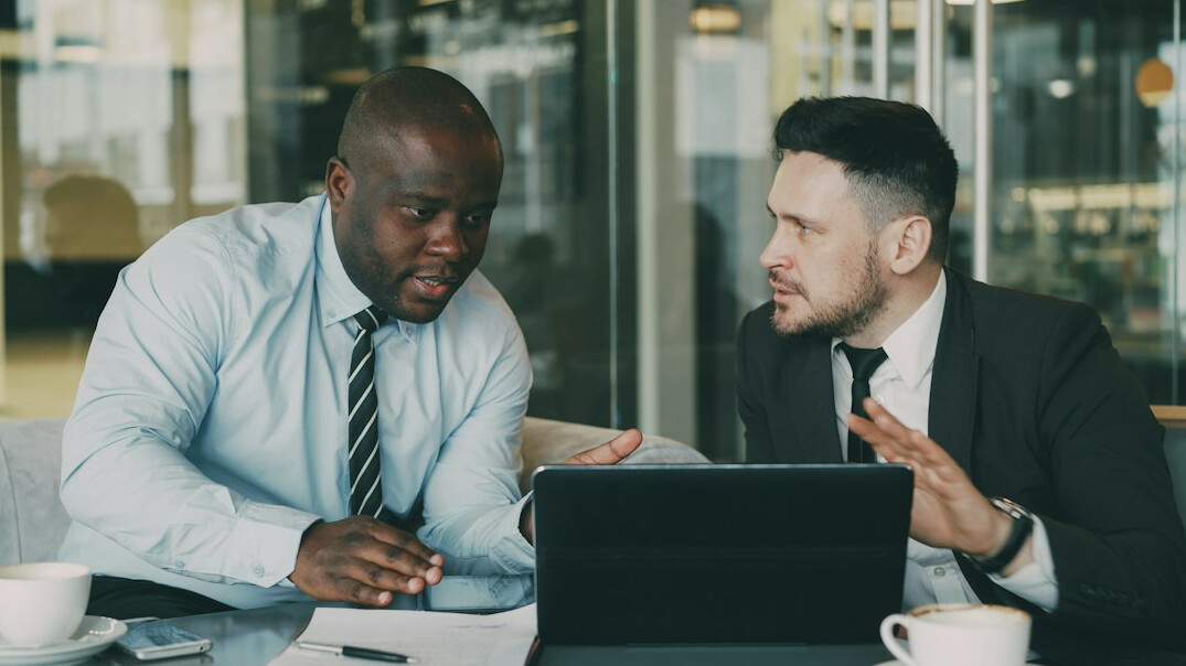 worried colleagues discussing